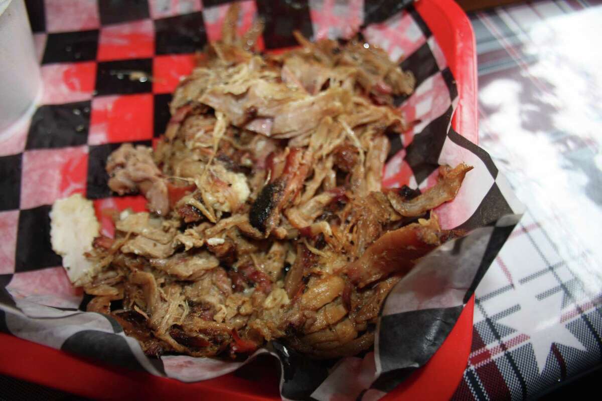 Pulled pork is a highlight on the Rusty Bucket BBQ menu, priced at $13.89 per pound.