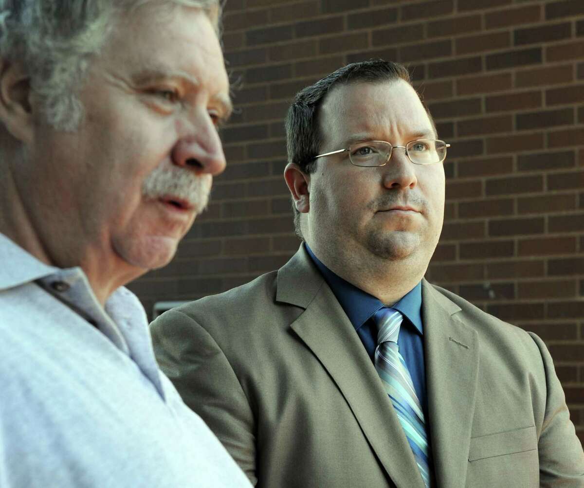 Former Danbury Police Officer Christopher Belair, right, with his father, Stephen, talks to the press at the conclusion of his trial in 2015 after being found not guilty of assault and threatening charges..