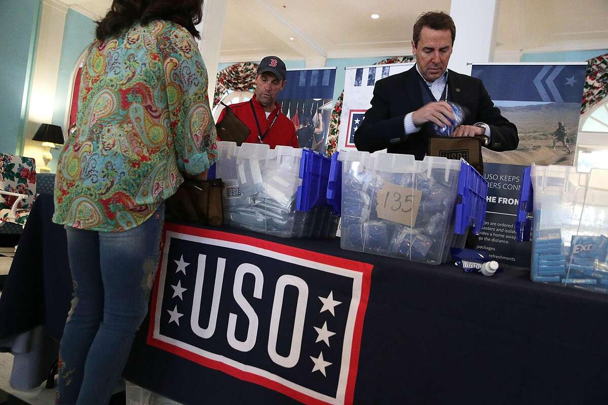 WHITE SULPHUR SPRINGS, WV - FEBRUARY 02: Rep. Mark Walker (R-NC) (R) and Rep. Steve Knight (R-CA) (2nd R) prepare care packages for USO during the 2018 House & Senate Republican Member Conference February 2, 2018 at the Greenbrier resort in White Sulphur Springs, West Virginia. Congressional Republicans wrap up the last day of their annual retreat at the Greenbrier where they discuss legislative agenda for the year. (Photo by Alex Wong/Getty Images)