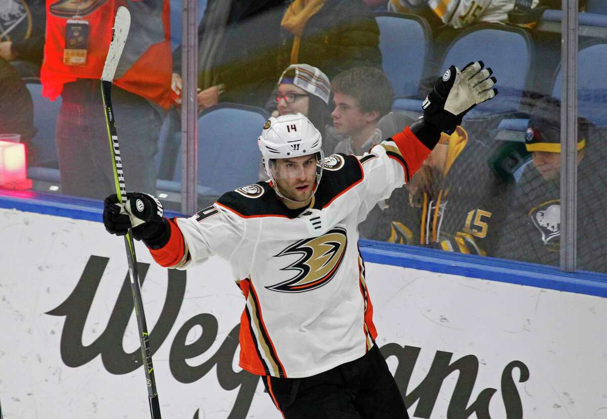 Anaheim Ducks forward Adam Henrique (14) celebrates his game winning goal during the overtime period of an NHL hockey game against the Buffalo Sabres, Tuesday, Feb. 6, 2018, in Buffalo, N.Y. (AP Photo/Jeffrey T. Barnes)