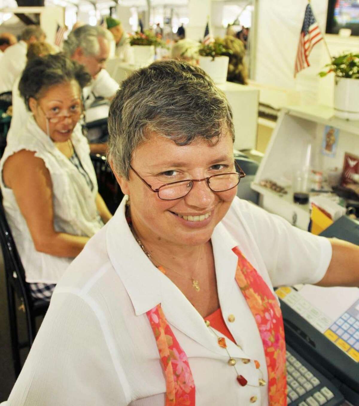 Mary Fergusson of Schenectady, a clerk at Saratoga Race Course for a quarter century, at her window in the Paddock Tent. (John Carl D'Annibale / Times Union)