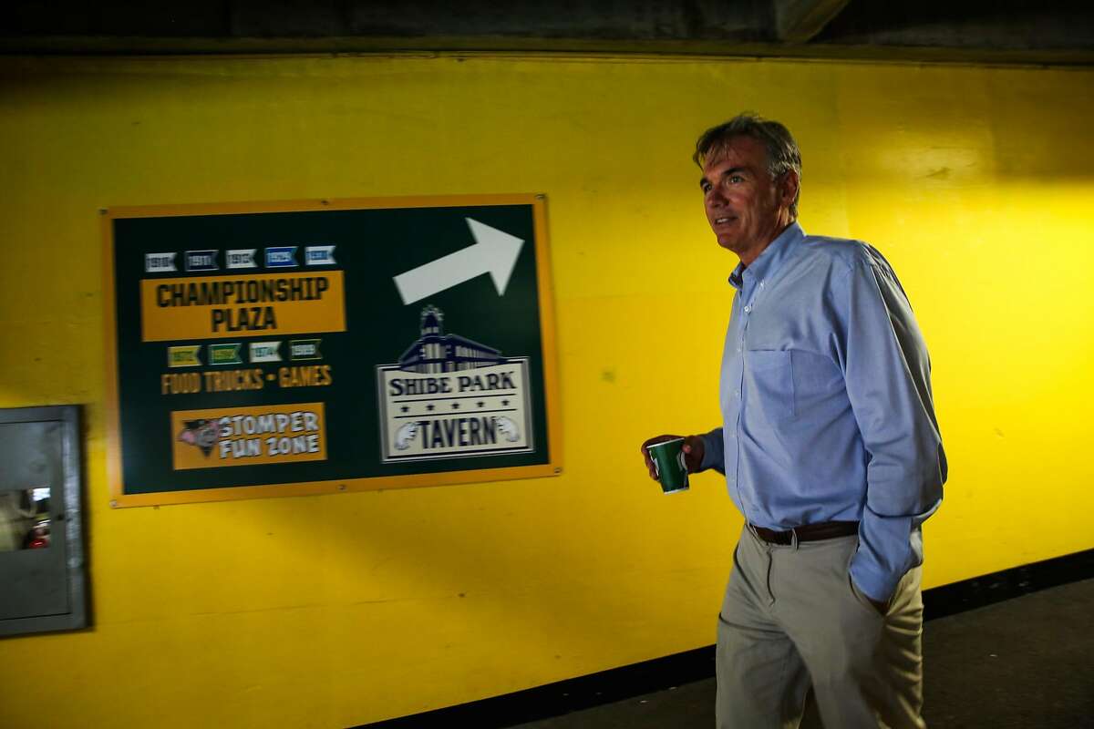 Billy Beane walks through the hallways of the Oakland Alameda County Coliseum during a portrait session in Oakland, Calif., on Monday, Aug. 14, 2017.
