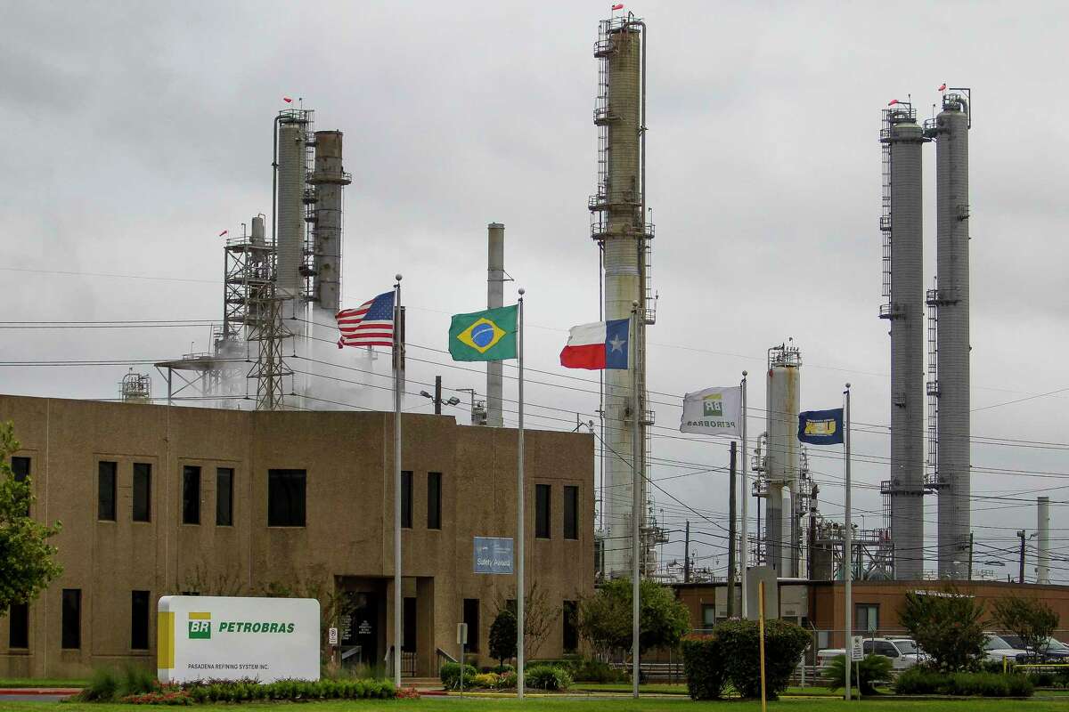 American, Texan and Brazilian flags fly outside a refinery owned by Petrobras, the Brazilian government's state-controlled oil producer, Tuesday, Oct. 20, 2015, in Pasadena. Petrobras paid more than $1 billion to buy the refinery from Pasadena Refining Systems Inc. in a series of transactions dating to 2006, a much higher price tag than the $42 million Astra Oil paid a year before. There is an ongoing criminal probe into the Pasadena deal as part of a larger Brazilian investigation into Petrobras transactions and allegations of bribery. (Michael Ciaglo / Houston Chronicle)