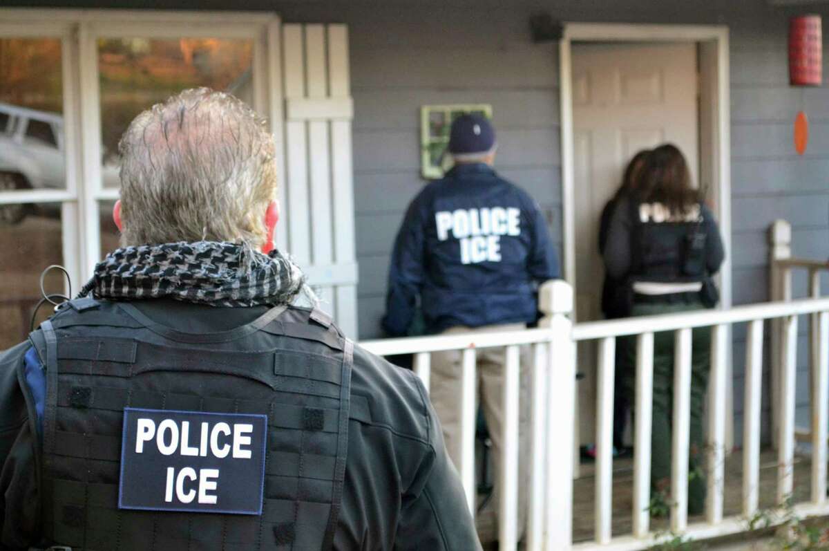 FILE-- U.S. Immigration and Customs Enforcement, ICE agents arrive at a home in Atlanta Feb. 9, 2017, during a targeted enforcement operation aimed at immigration fugitives, re-entrants and at-large criminal aliens.