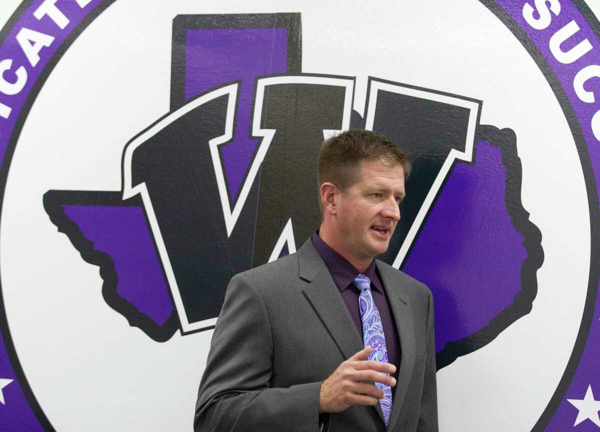 Michael Wall, former offensive coordinator at Lake Travis High School, is seen after being announced as Willis High School's new athletic coordinator and football coach, Wednesday, Feb. 7, 2018, in Willis.