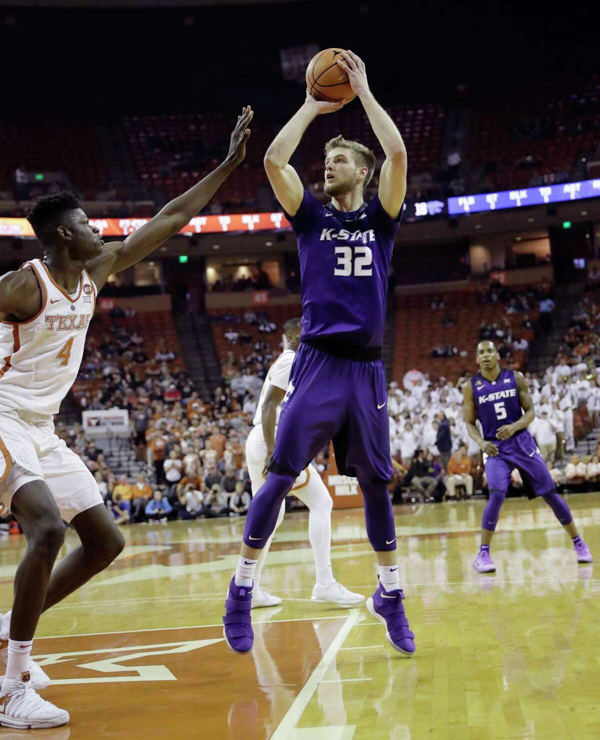 Kansas State forward Dean Wade (32) shoots over Texas forward Mohamed Bamba (4) during the first half of an NCAA college basketball game Wednesday, Feb. 7, 2018, in Austin, Texas. (AP Photo/Eric Gay)