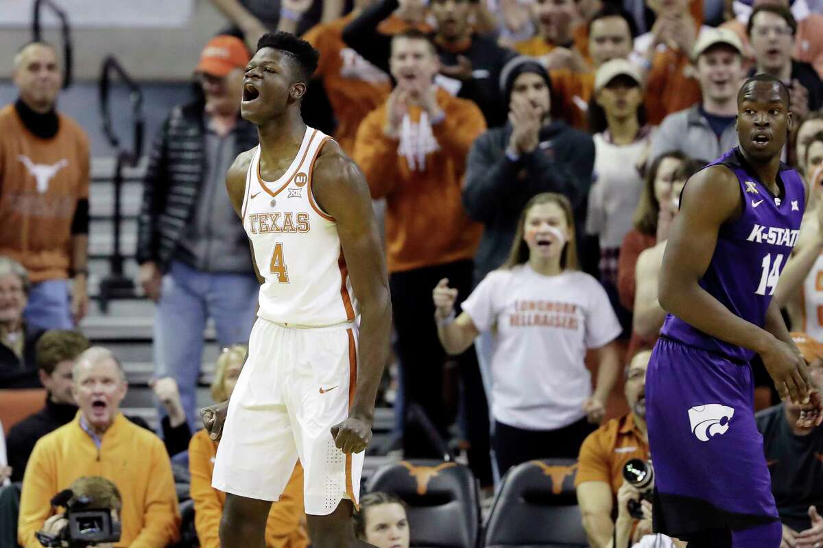 Texas forward Mohamed Bamba (4) reacts after he scored against Kansas State forward Makol Mawien (14) and was fouled on the play during the first half of an NCAA college basketball game Wednesday, Feb. 7, 2018, in Austin, Texas. (AP Photo/Eric Gay)