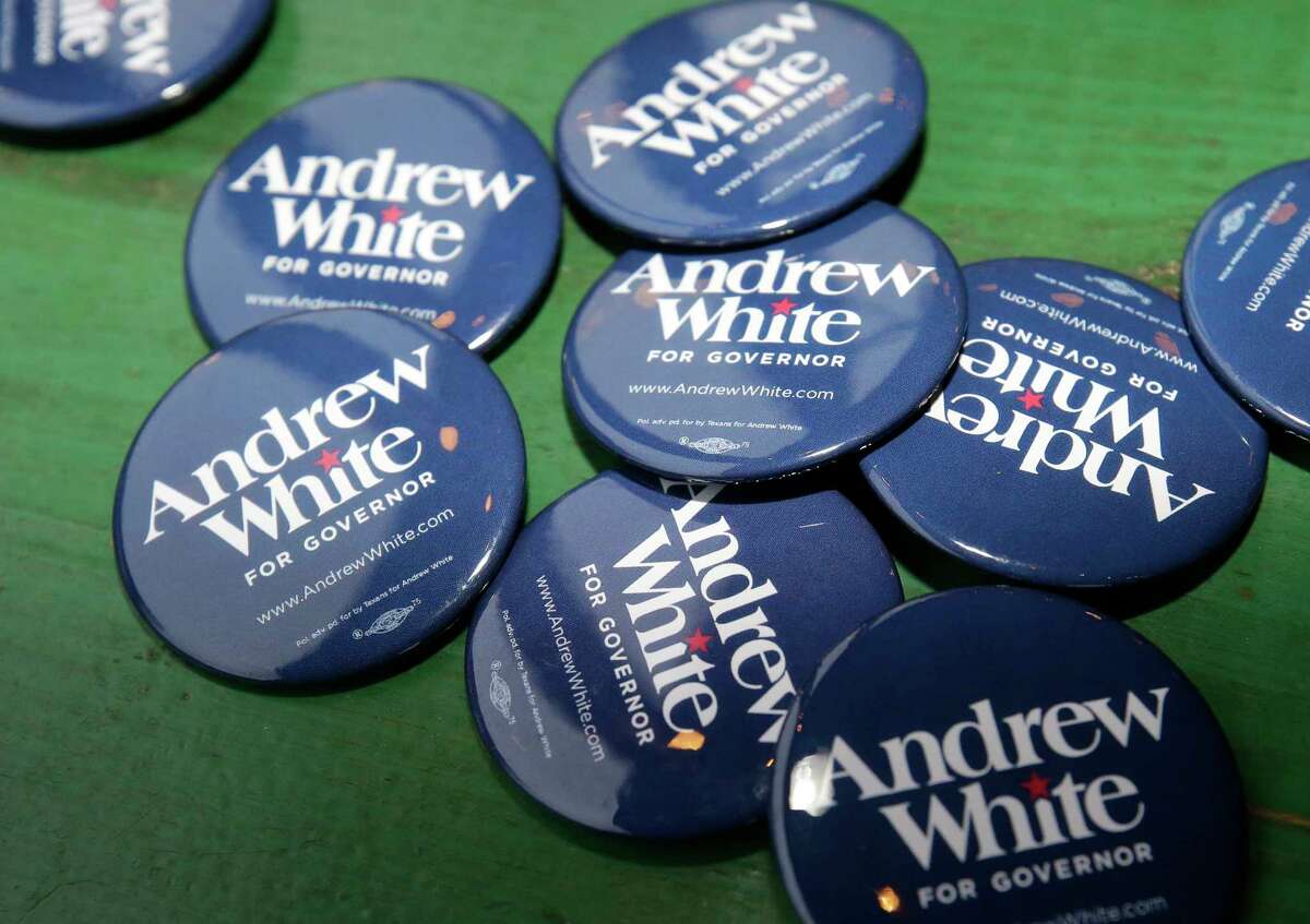 Campaign buttons for Andrew White, a Democratic candidate running for governor of Texas, are shown during event at Kirby Ice House, 3333 Eastside St., Wednesday, Feb. 7, 2018, in Houston.