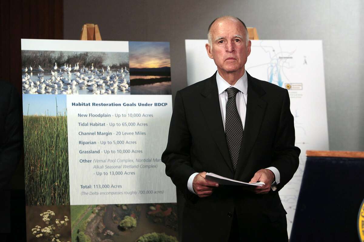 FILE - In this July 25, 2012 file photo, California Gov. Jerry Brown prepares to announce plans to build a giant twin tunnel system to move water from the Sacramento-San Joaquin River Delta to farmland and cities at a news conference in Sacramento. Brown is scaling back his troubled proposal for overhauling California's water system, at least for now. State official Karla Nemeth wrote Wednesday, Feb. 7, 2018 that the Brown administration is looking at building a single giant water tunnel now. California would build a second one later if the money is found for it. (AP Photo/Rich Pedroncelli, File)