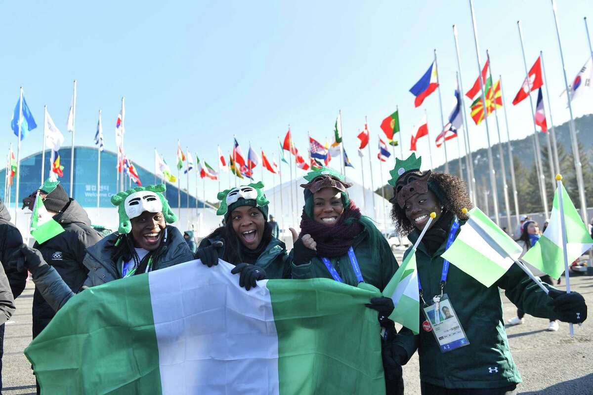 TOPSHOT - Nigeria's women's bobsleigh and skeleton team members Seun Adigun, Ngozi Onwumere, Akuoma Omeoga and Simidele Adeagbo attend a welcoming ceremony for the team in the Olympic Village in Pyeongchang ahead of the Pyeongchang 2018 Winter Olympic Games on February 6, 2018. / AFP PHOTO / LOIC VENANCELOIC VENANCE/AFP/Getty Images