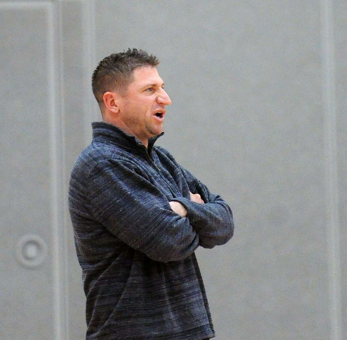 Staples girls basketball coach Paco Fabian during a recent game against Greenwich. Fabian served a one-game suspension after being ejected from a game last week in a loss to Stamford.