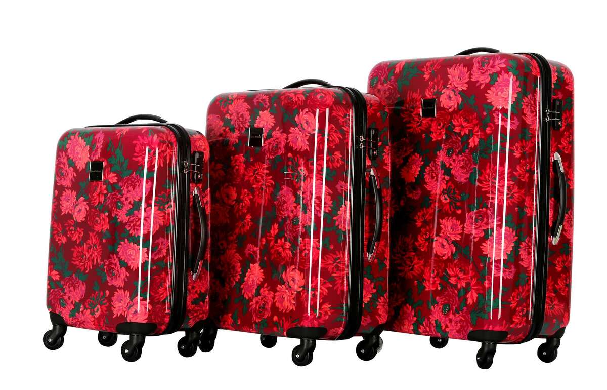 Isaac Mizrahi Irwin 2 Collection in Berry - The hardside 8-wheeled luggage made of durable polycarbonate absorbs impacts and features 360-degree multi-directional spinner wheels that glides easily on all surfaces. LongLat