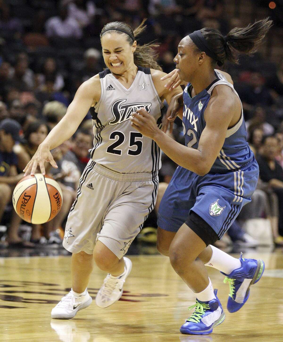 Stars' Becky Hammon is fouled by Lynx's Monica Wright during second half action Sunday, July 1, 2012 at the AT&T Center. The Stars won 93-84.