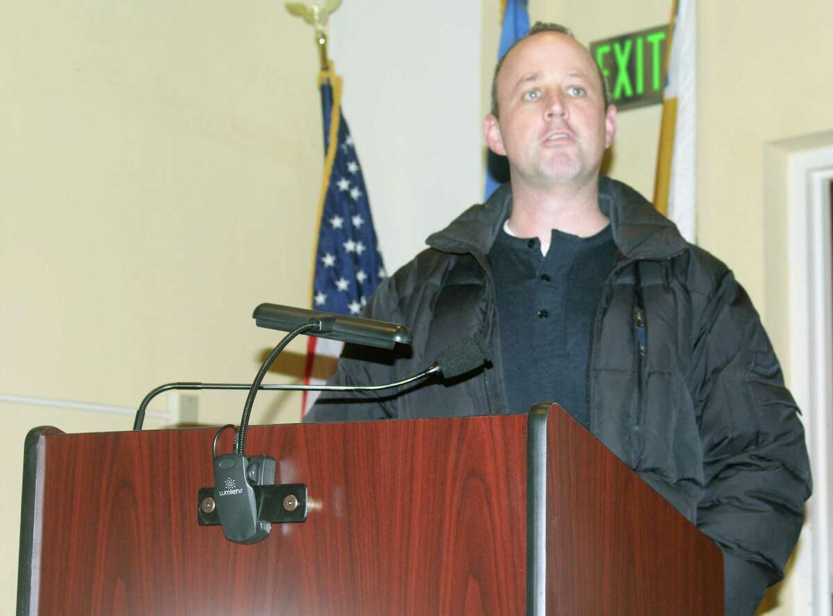 Robert Harrington, who is requesting the school board tighten their budget, speaks at a December meeting of the Planning and Zoning Commission in Westport, Conn.