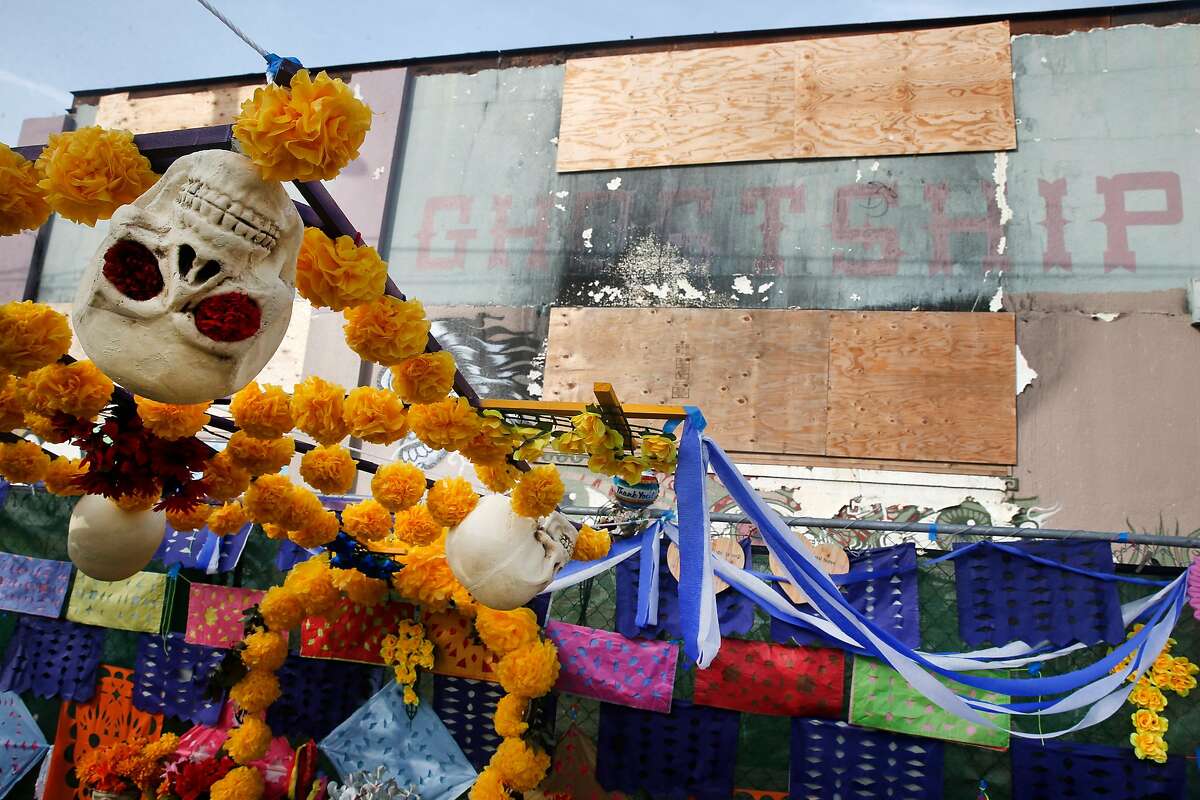 A memorial is erected in front of the Ghost Ship warehouse in Oakland, Calif. on Saturday, Dec. 2, 2017 for the 36 people that died in the fire at the site one year ago.