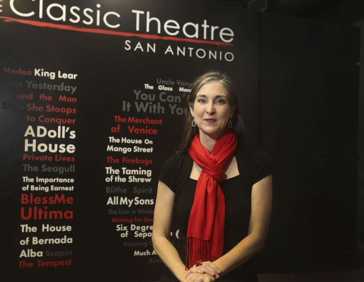Kelly Hilliard Roush poses in the lobby of Classic Theatre, which she serves as artistic and executive director. The entry to the theater includes a wall commemorating every show the company has produced in its 10 year history.