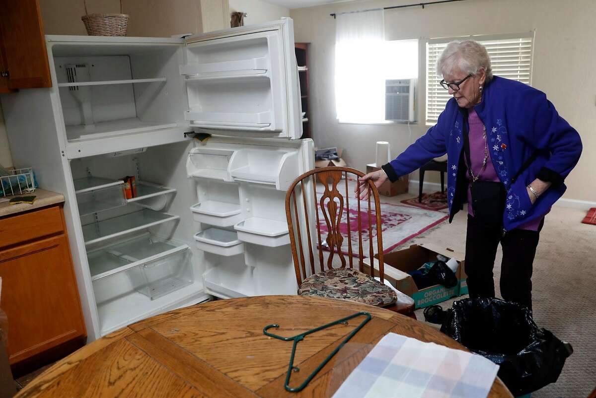 Journey's End resident Theresa Udall visits her red-tagged residence n Santa Rosa, Calif., on Tuesday, January 30, 2018.