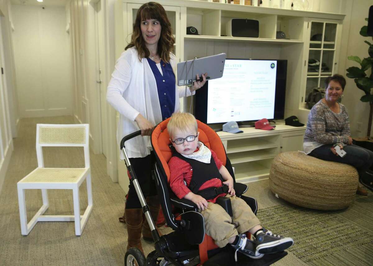 Christy Wilkens and her two-year-old son, Oscar, arrive to buy cannabidiol at Compassionate Cultivation in Manchaca, Texas facility, Thursday, Feb. 8, 2018. Her son suffers from epilepsy and will take the oil for the brain disorder.