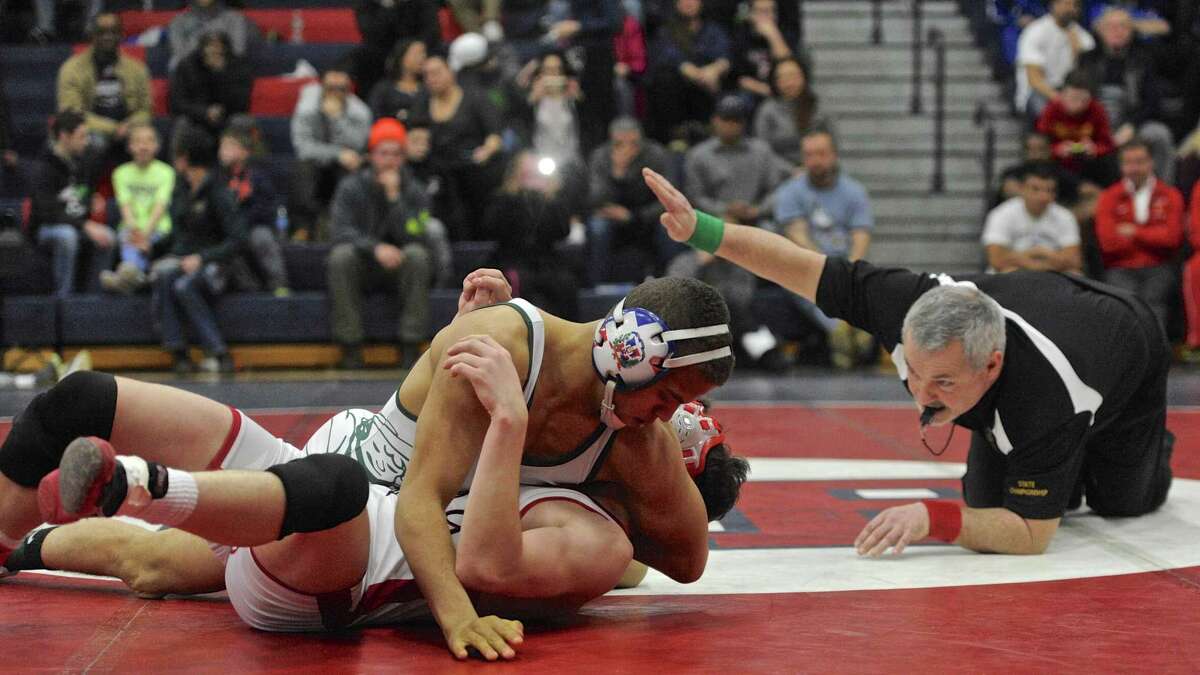 New Milford's Mel Ortiz and Masuk's Tore Gambino wrestle for the 126 pound weight class SWC wrestling championship on Saturday, February 11, 2017, at New Fairfield High School, in New Fairfield, Conn.