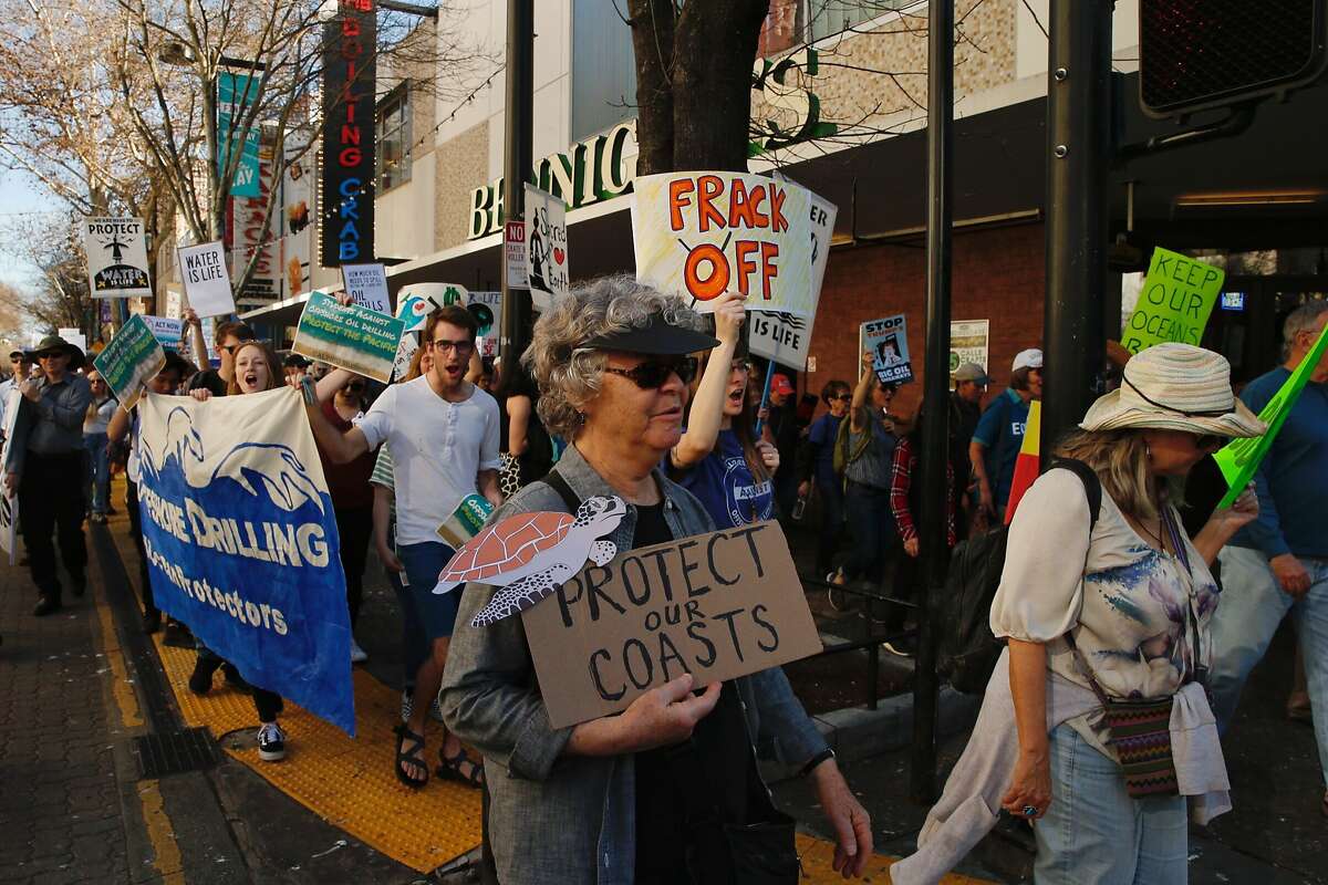Hundreds of protesters march after a rally at the California State Capitol, Thursday, Feb. 8, 2018, in Sacramento, Calif. Hundreds of people protested against offshore oil drilling.