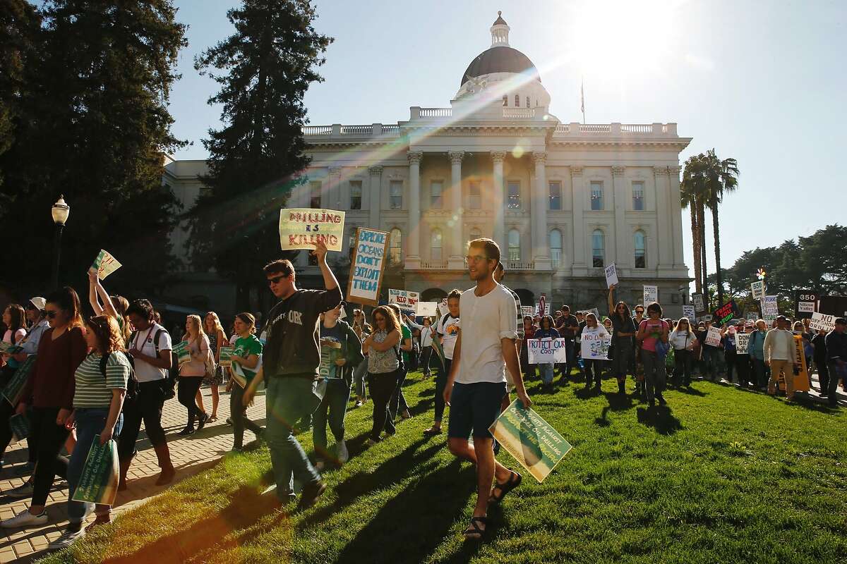 Hundreds of protesters march after a rally at the California State Capitol on Feb. 8, 2018, against offshore oil drilling.