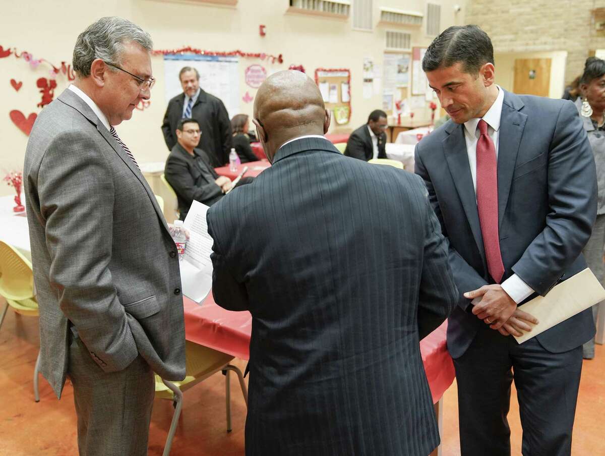 Incumbent district attorney Nico LaHood, right, and DA candidate Joe Gonzales, left, prepare before a debate, Thursday, Feb. 8, 2018, at the Claude Black Community Center in San Antonio. (Darren Abate/For the San Antonio Express-News)