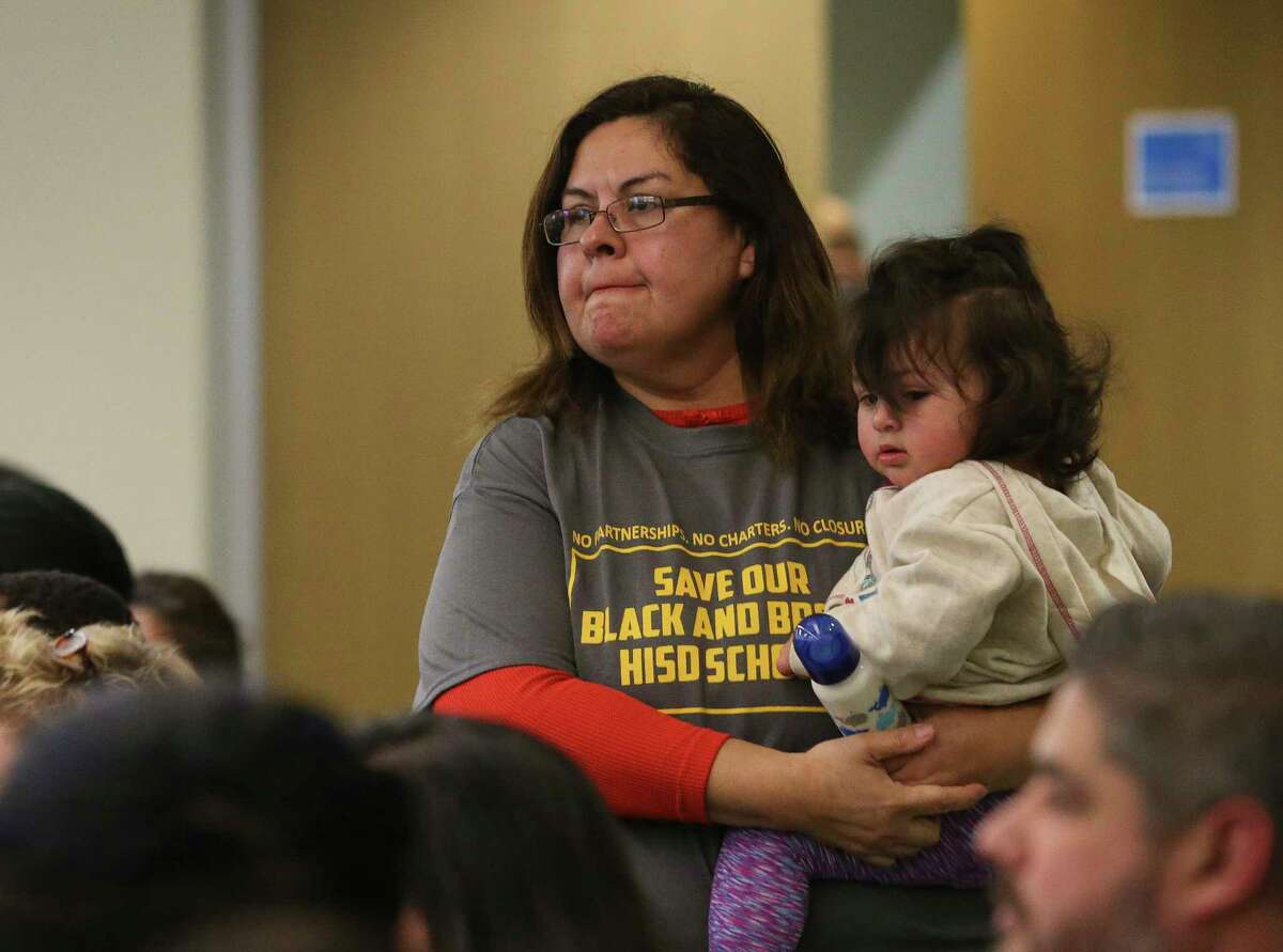 Cladia Rios wears "Save Our Black and Brown HISD Schools" t-shirt to attend Houston ISD Board of Trustees public hearing at Hattie Mae White Educational Support Center on Thursday, Feb. 8, 2018, in Houston. It was the first hearing from the HISD community for the first time since plans were announced for major changes at 14 low-performing schools, and the hundreds came to the hearing. The back of the t-shirt listed the names and years of establishment of those 14 schools. Rios or her family did not go to one of the 14 schools but showed up to support the schools to remain open.