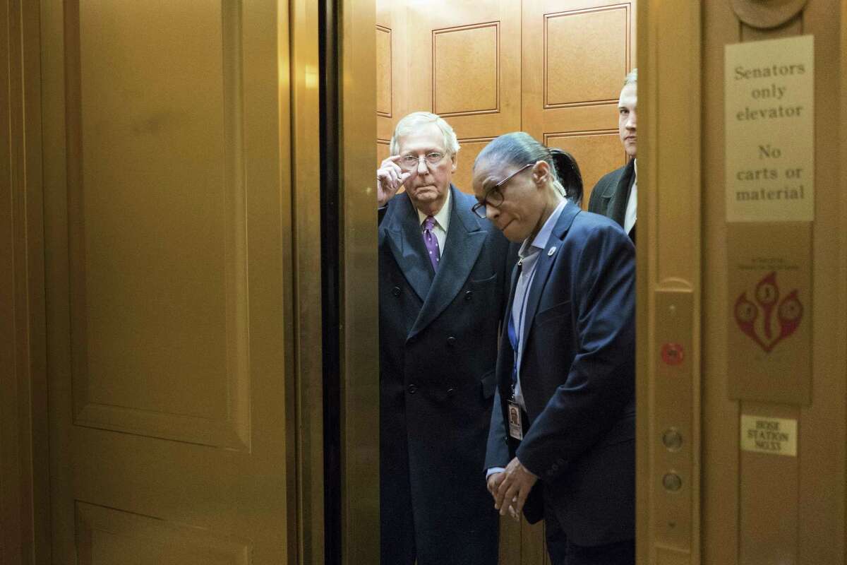 Senate Majority Leader Mitch McConnell (R-Ky.) takes an elevator as a budget deadline approached, on Capitol Hill in Washington, Feb. 8, 2018. The federal government on Thursday night slid toward at least a brief shutdown as Kentuckyís other Republican senator, Rand Paul, delayed a vote on a far-reaching budget deal in a floor speech in bemoaning out-of-control government spending. (Erin Schaff/The New York Times)