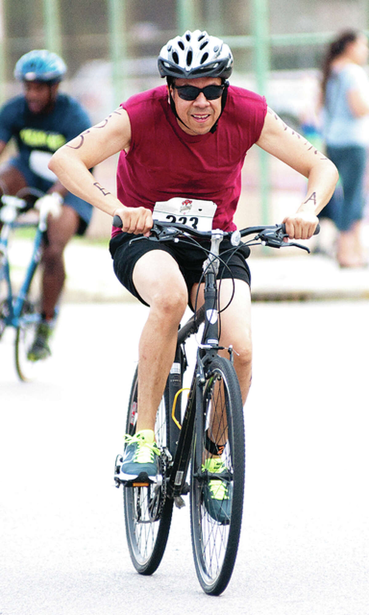 The triathletes also had to bike for 12 miles, traversing a two-mile radius on neighboring streets of the Wood River Aquatic Center.