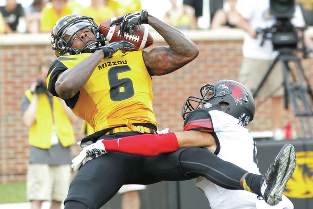Missouri wide receiver J’Mon Moore (6) catches a touchdown pass over Southeast Missouri State cornerback Michael Ford (4) Saturday at Faurot Field in Columbia, Mo.
