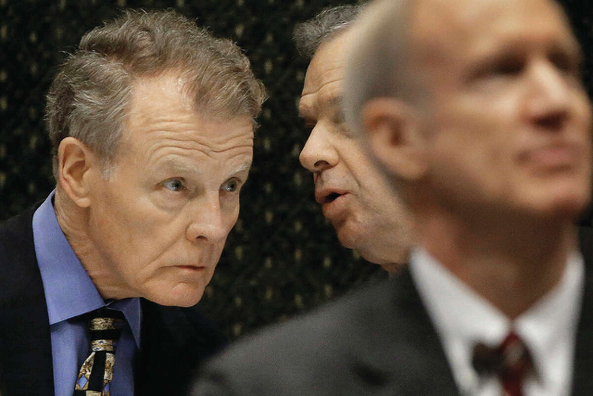 Seth Perlman | AP Speaker of the House Michael Madigan (left) speaks to Senate President John Cullerton (center) while Gov. Bruce Rauner delivers the State of the Budget Address to a joint session of the General Assembly in the House chambers at the Illinois State Capitol. The political rivalry between the Republican Rauner and the Democratic Madigan has intensified during Illinois’ 10-month budget stalemate, leaving little hope that the state will have a spending plan any time soon.