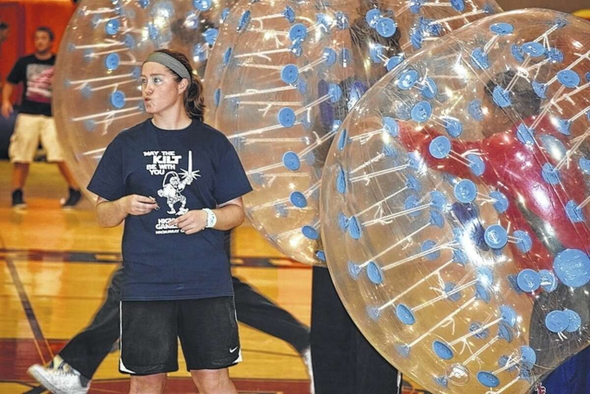 Students participate in a heated game of “Bubble Soccer” Wednesday at the Highland Games, a fun day of activities for students to enjoy before studying for finals. Other fun activities included paint twister, the caber toss, bounce events, free popcorn, snow cones, and lunch.