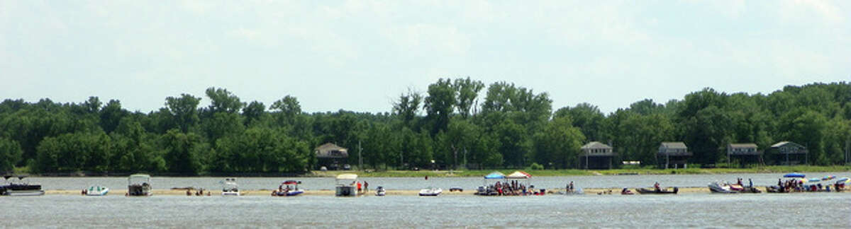 People have fun on a sand bar on the Illinois River at Grafton.