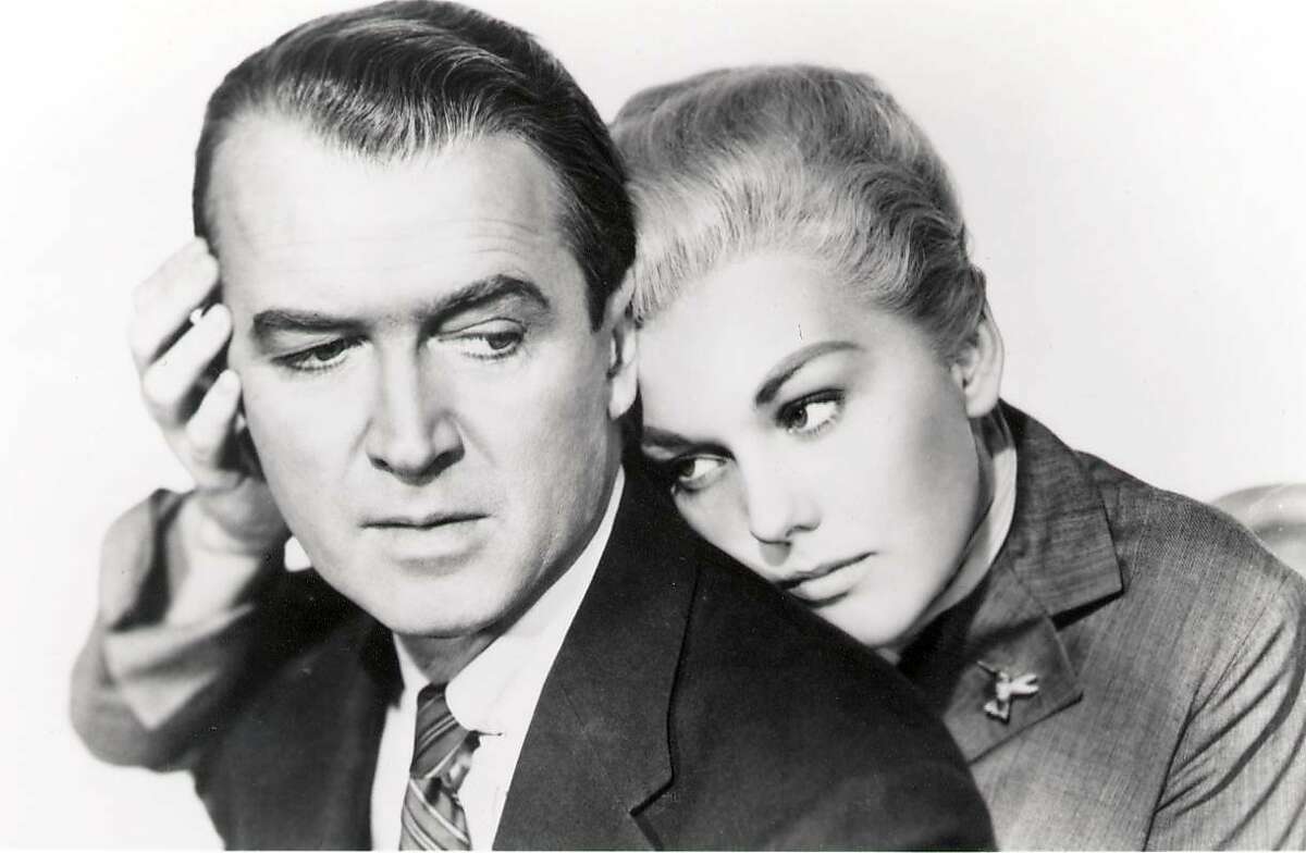 James Stewart and Kim Novak in Hitchcock's classic 'Vertigo.' James Stewart is John "Scottie" Ferguson, a former police detective with an acute fear of heights who is hired by an old college pal to trail his mysterious wife (Kim Novak). (1997)