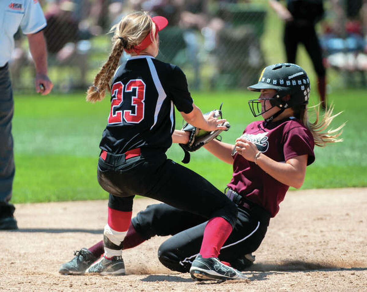 Calhoun shortstop Ashleigh Presley (left) puts the tag on Princeville baserunner Caitlin Pullen at second base during Friday’s Class 1A semifinal in East Peoria.