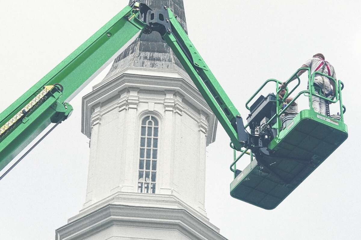 David Blanchette | Journal-Courier Mike Clark and Patrick Mack of J.B. Large & Sons Painting Contractors work on painting the steeple of Rammelkamp Chapel at Illinois College.