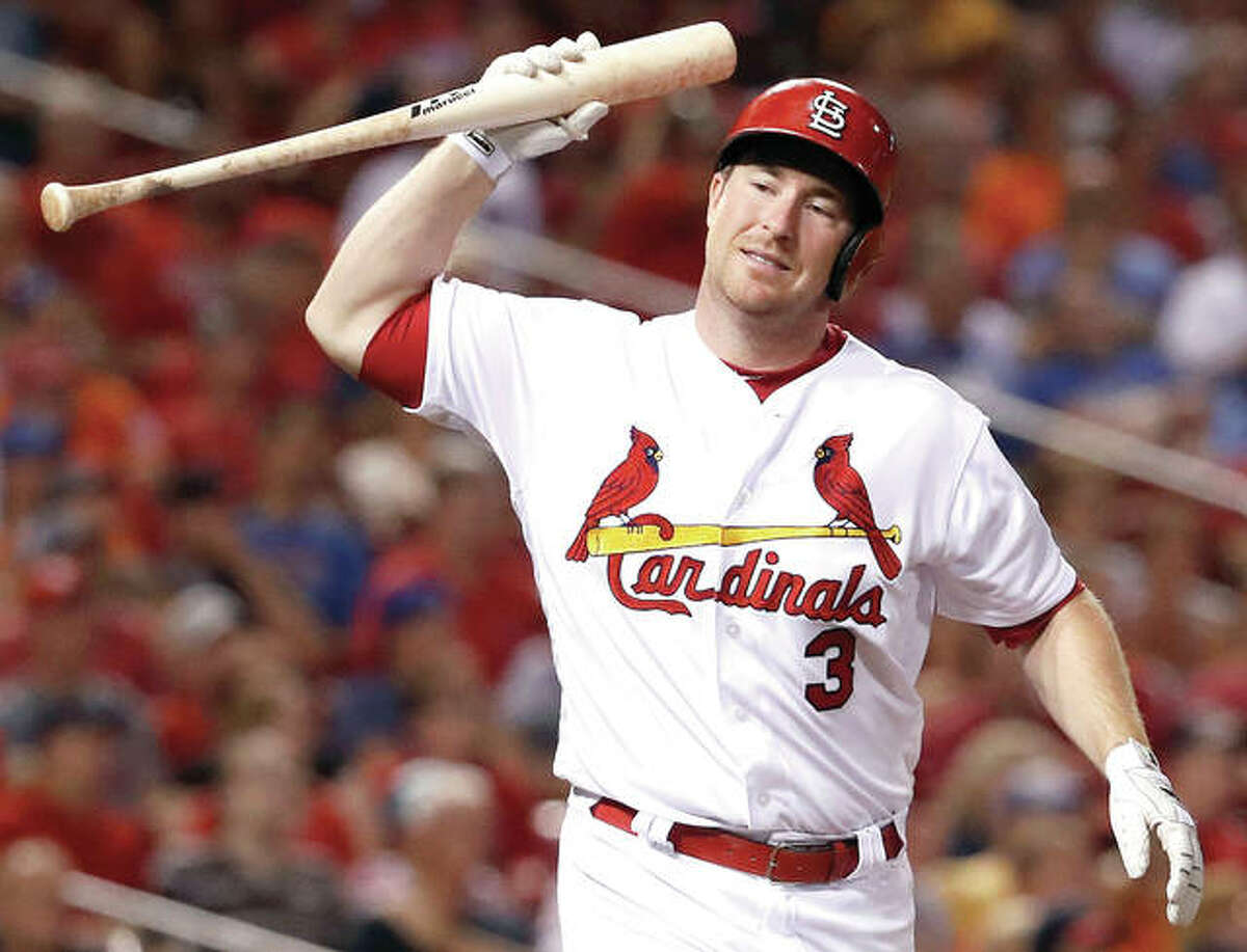 The Cardinals’ Jedd Gyorko tosses his bat after hitting a sacrifice fly to score Matt Carpenter in the eighth inning of Fridays loss to the Mets at Busch Stadium.