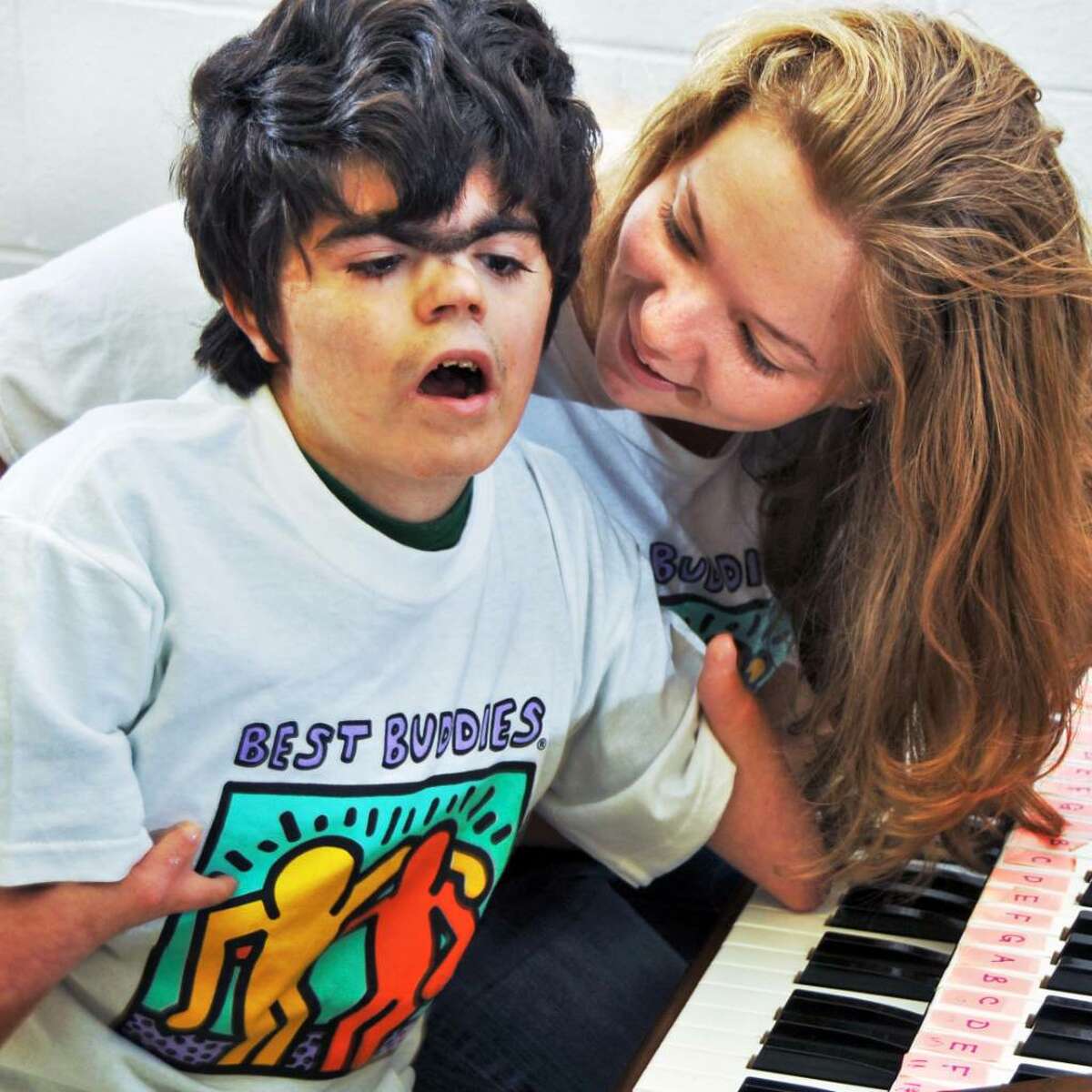 Ballston Spa High School students, senior Ashlie Busone and Best Buddies program student Will Smisloff, share a keyboard in a music room at the school Tuesday morning. Local organizers want to expand the number of area chapters. (John Carl D'Annibale / Times Union)