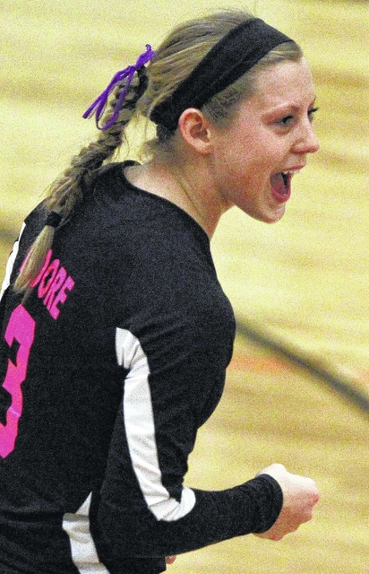 West Central’s Alexis Moore celebrates a point during a match against Greenfield-Northwestern Saturday in Waverly.