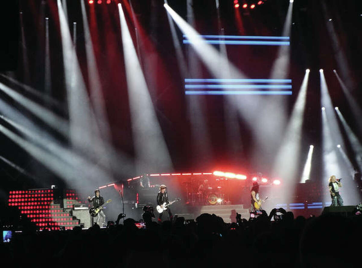 Guns N’ Roses made a St. Louis stop Thursday at the Dome at America’s Center on their Not in This Lifetime… Tour. It’s the first time GN’R has played St. Louis since the infamous 1991 Use Your Illusion Tour date at Riverport Amphitheatre, now Hollywood Casino Amphitheatre, in Maryland Heights, Missouri, where a riot occurred when someone tried to take unauthorized photos. The band left the stage, angering fans. Frontman Axl Rose acknowledged the chaotic date unperturbed Thursday night, giving props and respect to the people of St. Louis, putting the issue to rest. Pictured from left to right, guitarist Richard Fortus, of St. Louis; bassist Duff McKagan; guitarist Slash; and, Rose.