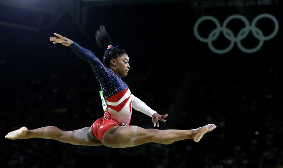 United States' Simone Biles performs on the balance beam during the artistic gymnastics women's team final at the 2016 Summer Olympics in Rio de Janeiro, Brazil, Tuesday, Aug. 9, 2016. (AP Photo/Rebecca Blackwell)