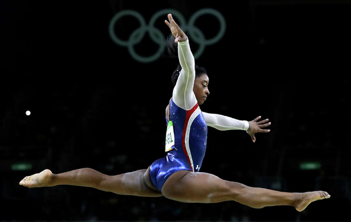 United States' Simone Biles performs on the balance beam during the artistic gymnastics women's individual all-around final at the 2016 Summer Olympics in Rio de Janeiro, Brazil, Thursday, Aug. 11, 2016. (AP Photo/Rebecca Blackwell)
