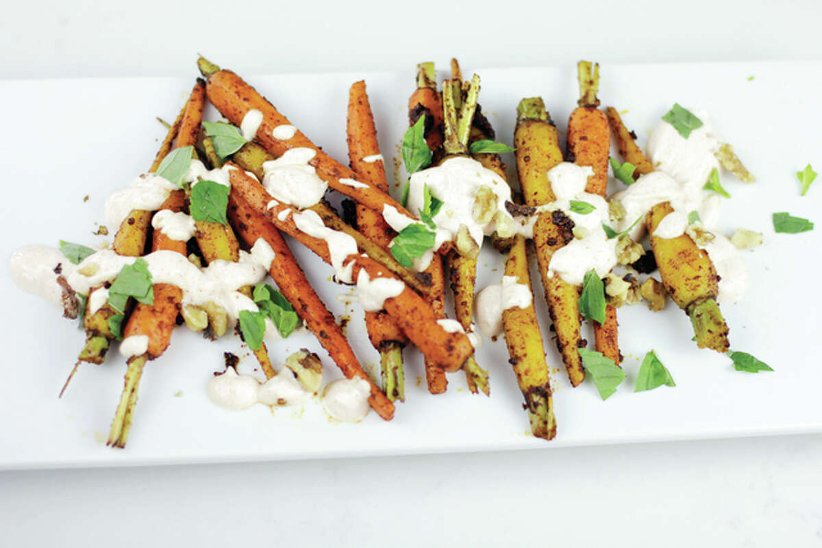 Moroccan spiced carrots with yogurt sauce adds a bit of zest to what can be a bland vegetable.