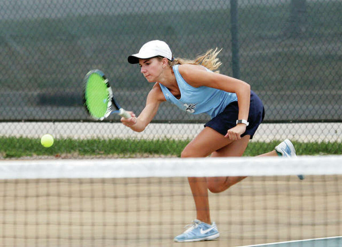 Jersey’s Libby Roth rushes to return a shot during her No. 2 double’s match against Civic Memorial on Wednesday in Jerseyville. Roth won her No. 3 singles match before losing in doubles in a 5-4 Panthers dual victory.