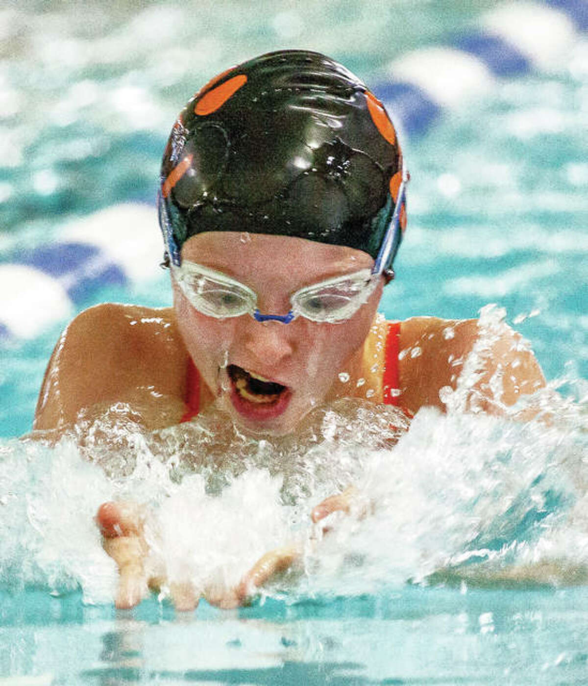 Edwardsville’s Sarah Lange swims in the 200-yard breaststroke Saturday in the Swim for Hope Invitational at the Chuck Fruit Aquatic Center. Lange finished third in a time of 2:43.45.