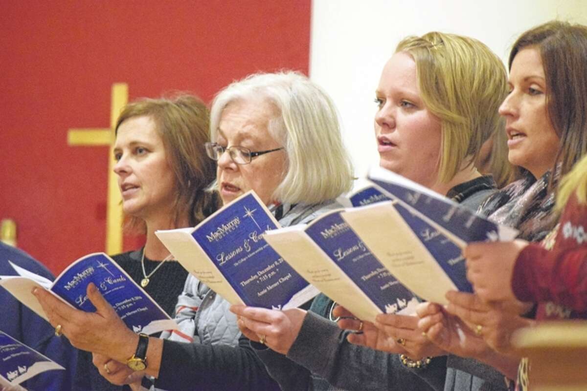 Members of the MacMurray College faculty and the Lincoln Avenue Baptist Church choir sing Christmas carols Thursday night during “Lessons & Carols,” MacMurray’s Advent worship service at Annie Merner Chapel.