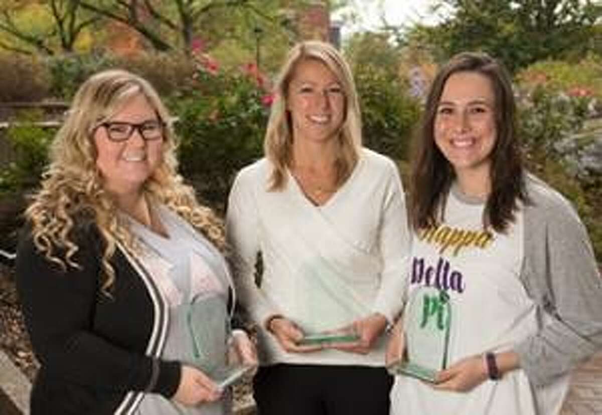 Displaying three of their four Achieving Chapter Excellence Awards are Lambda Theta Chapter of Kappa Delta Pi (KDP) International Honor Society in Education members (L-R): Sierra Hyman, KDP co-president a senior elementary education major; Barbara Martin, KDP faculty advisor; and Kalli Hentis, KDP co-president and senior majoring in speech-language pathology.
