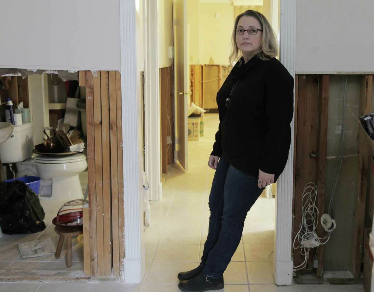 Months after Hurricane Harvey hit, Sharon Bippus is still dealing with the damage at her townhome.﻿