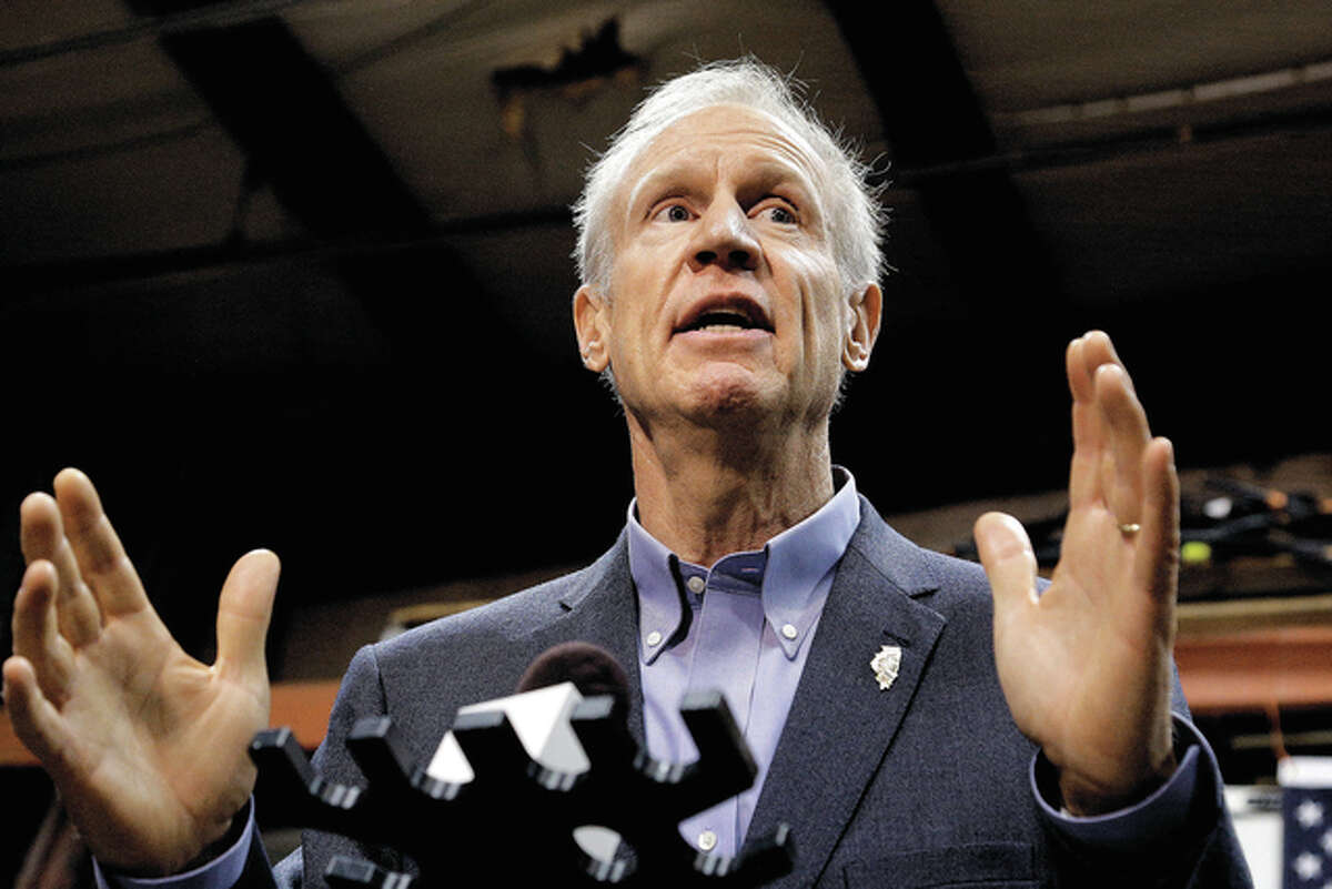 Seth Perlman | AP Gov. Bruce Rauner speaks to reporters after meeting with legislative leaders during veto session in Springfield. The General Assembly convenes today for just two days to finish its work before a new session begins Wednesday while the two-year budget standoff looms large.