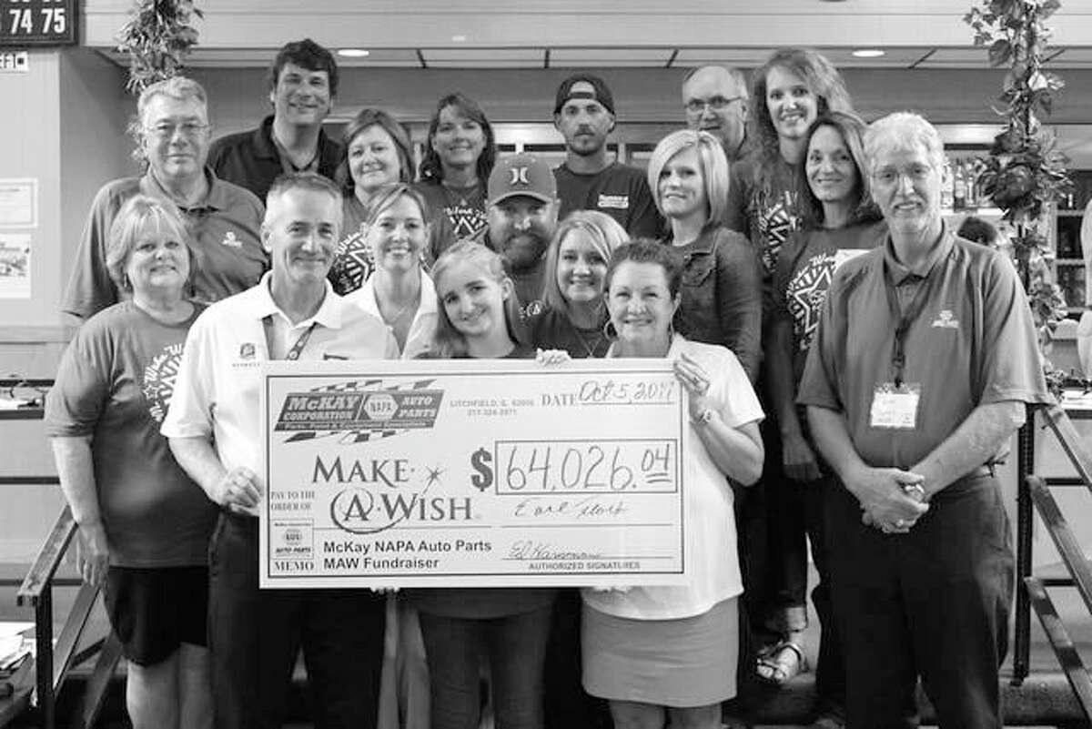 Left to right: Earl Flack, President, McKay NAPA Auto Parts; Grace Hassard, 14, ‘Wish Child’; Kathy Eames, Make-A-Wish Volunteer; Norman May, Outside Sales Manager, McKay NAPA. Row two: Sue Miller, McKay NAPA Promotions Coordinator & Executive Assistant; Kathy Neville, Make-A-Wish Volunteer; Jerilyn Hassard, Staunton, Grace’s Mother. Row three: Jim McKay, McKay Corporation; Bart Hassard, Staunton, Grace’s Father; Casey Logsdon, Accounts Payable and Peggy Snell, Office Manager, McKay NAPA Auto Parts. Row four: Ryan Ocepek, Operations Mgr./IT and Toni White, Accts. Payable, both of McKay NAPA; Josh Ronco of Ronco’s Auto Body, Collision Repair & Custom Shop, Litchfield, designer of the McKay NAPA 2017 Ford Bronco Make-A-Wish Benefit Cart; Ed Hammann, Vice President, and Alex Carter, both of McKay NAPA Auto Parts.